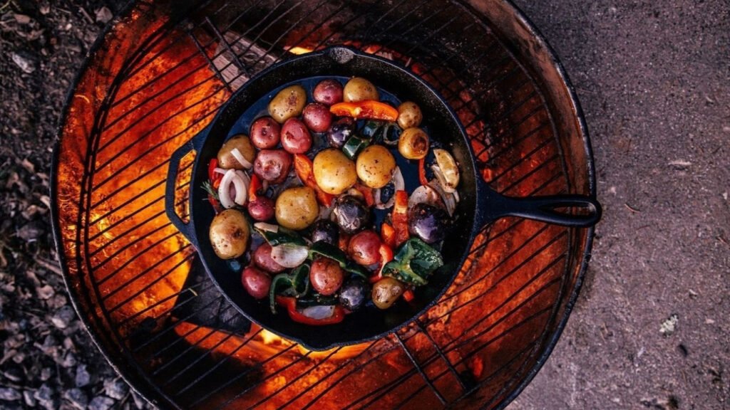 Cast iron grill plate on outdoor BBQ with char marks — Castinex cast iron cookware for grilling and open flame cooking